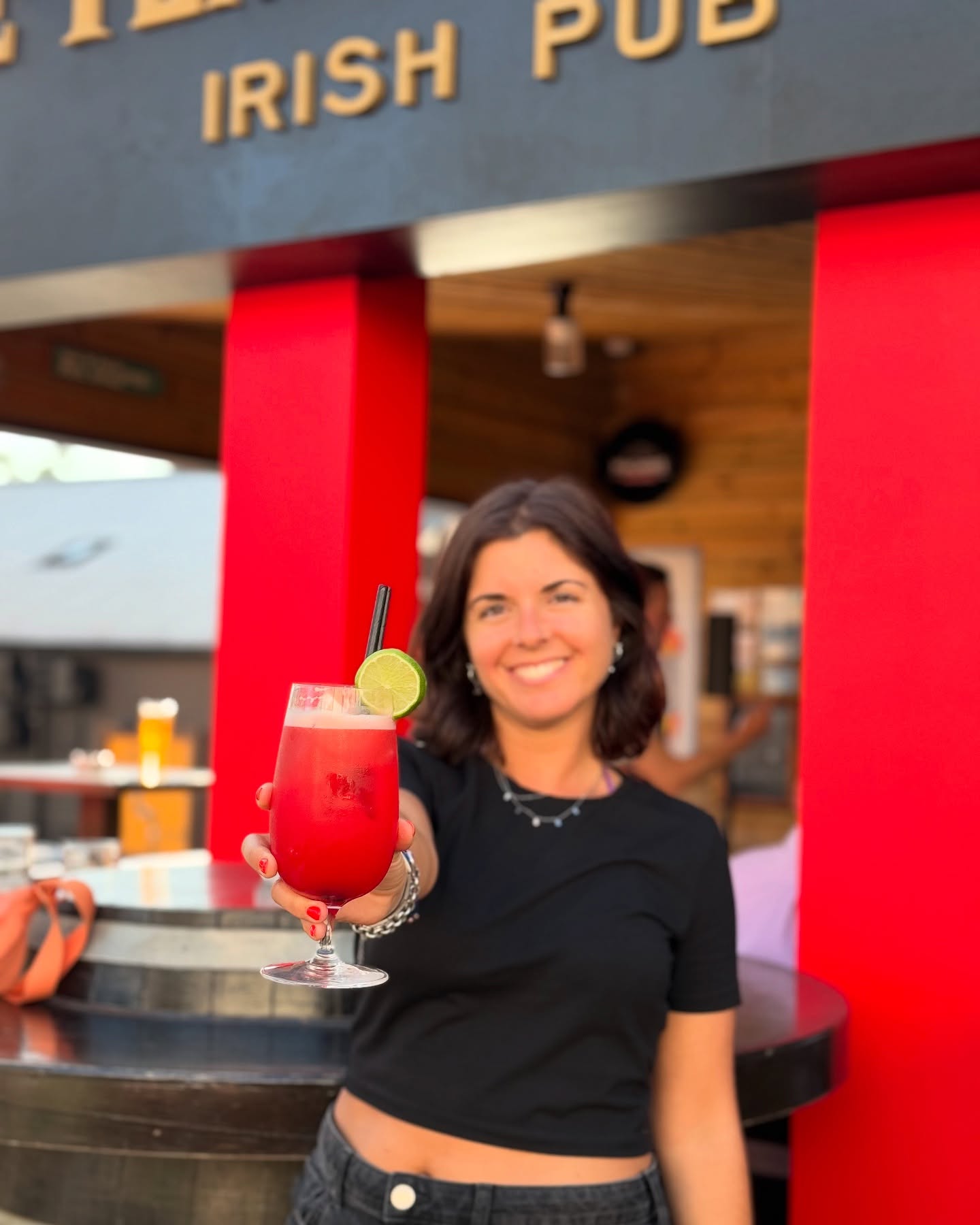 Red cocktail outside The Temple Corner