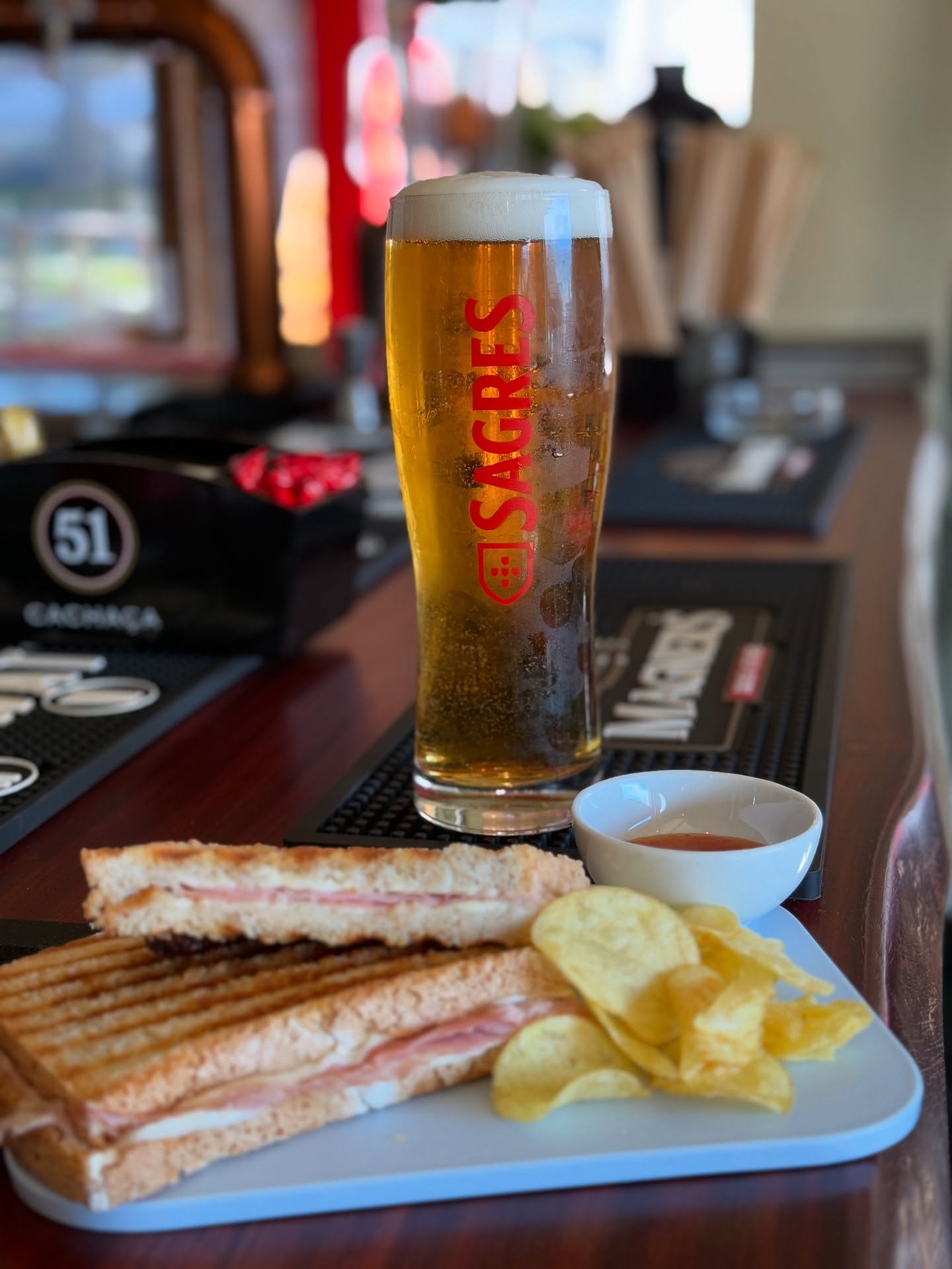 Sagres beer with toastie and chips