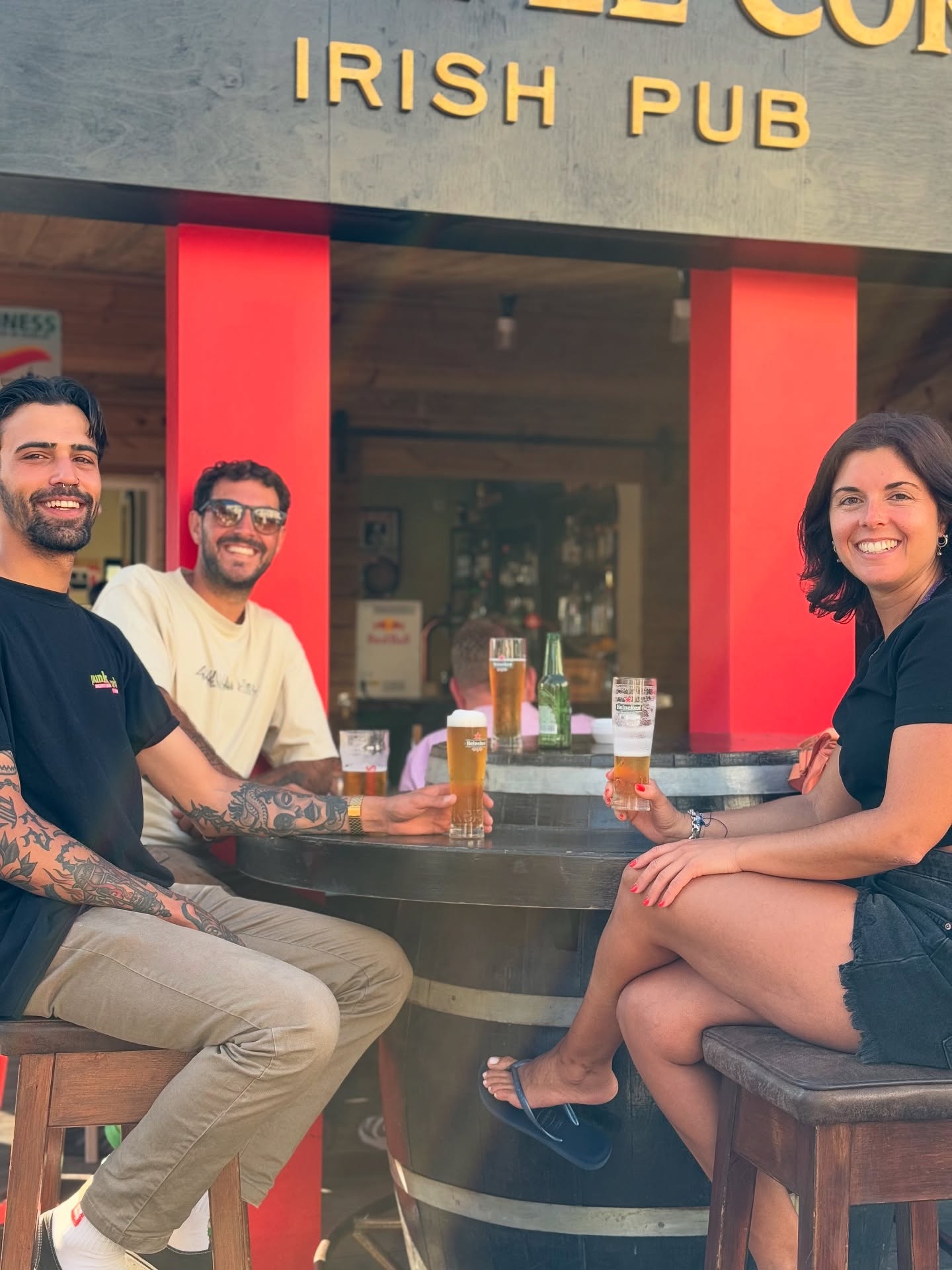 Friends drinking outside the pub
